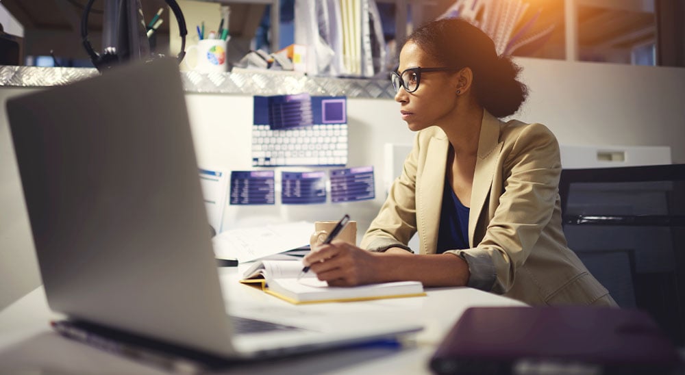 Female professional with glasses working