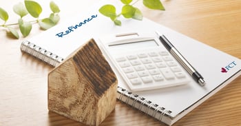 Calculator and pen on a notebook