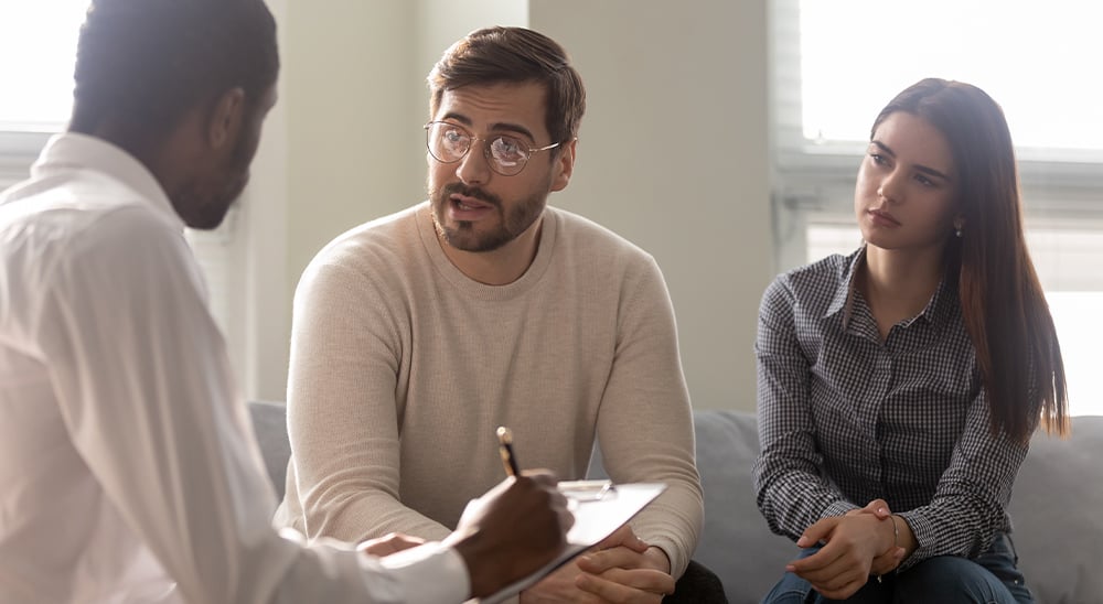 Financial professional meeting with a young couple