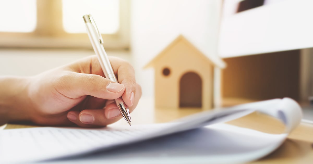 Man signing document close up 