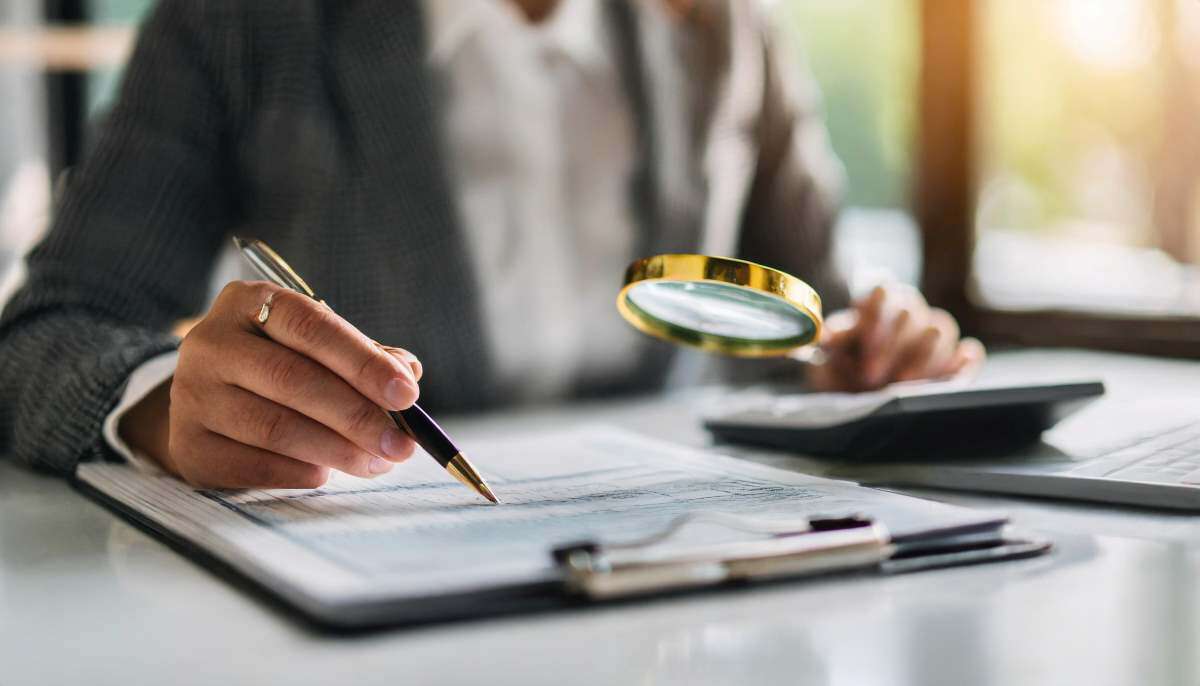 Magnifying glass reading over documents